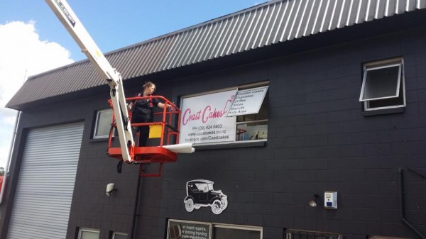 Up goes some signage
